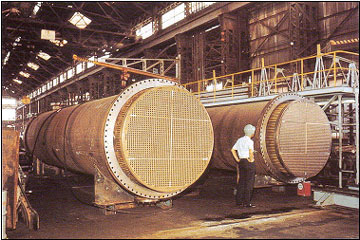 Clad tube plates for heat exchangers